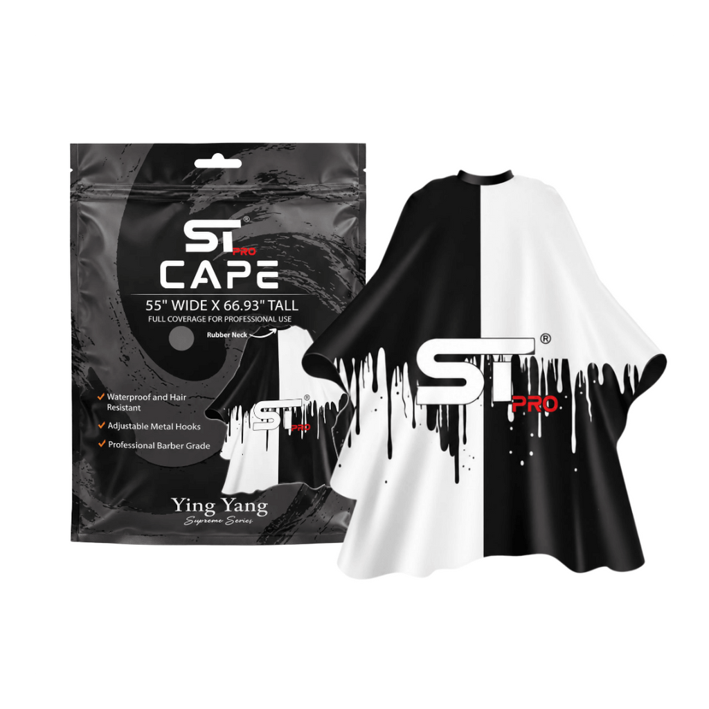Black-and-white split-design barber cape displayed beside its packaging