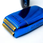 Blue electric shaver with gold foil on a white background