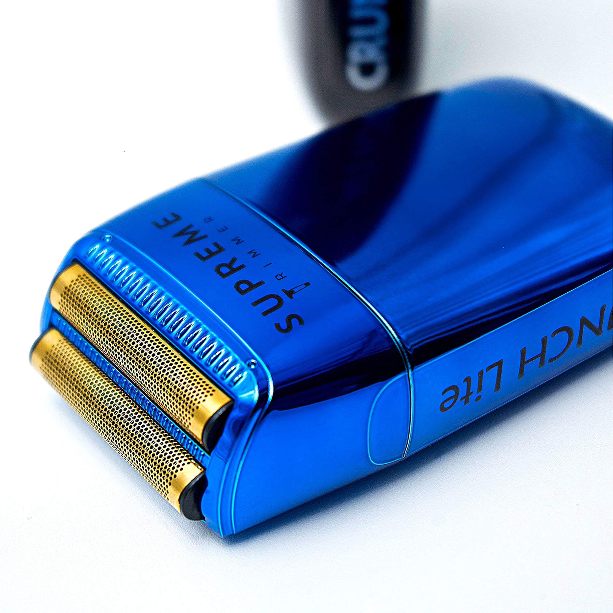 Blue electric shaver with gold foil on a white background