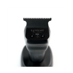 Supreme Trimmer TB560 deep-tooth T-blade installed on a professional hair trimmer, showing the cutting head and blade design.
